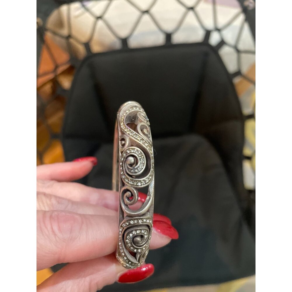 This is a Brighton Anahita silver-plated scrolled hinged bangle bracelet with Sw - Picture 2 of 8